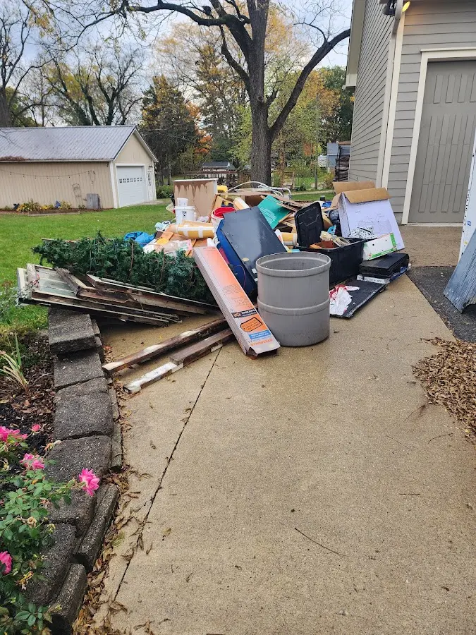 Dumpster being loaded with debris for 3 Yard Dumpster Rental in Harvard